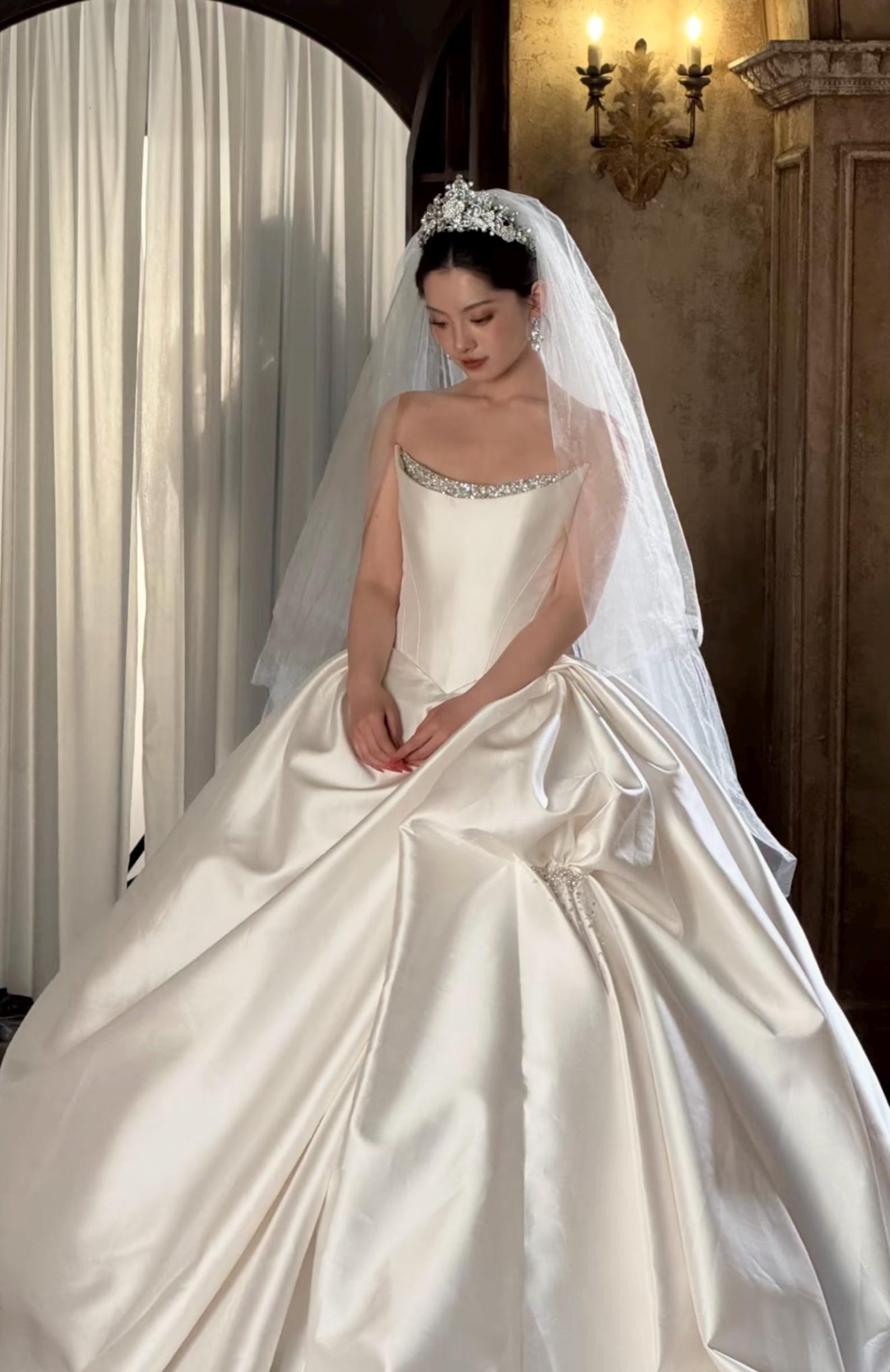 Strapless luxury mikado satin ball gown, crystal neck trim & oversized beaded bow, dreamy princess bridal dress for formal weddings.
